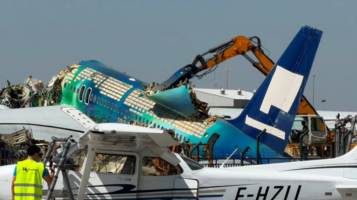 Icelandair’s Hekla Aurora Boeing 757 being dismantled behind a parked light aircraft at Lleida–Alguaire Airport.