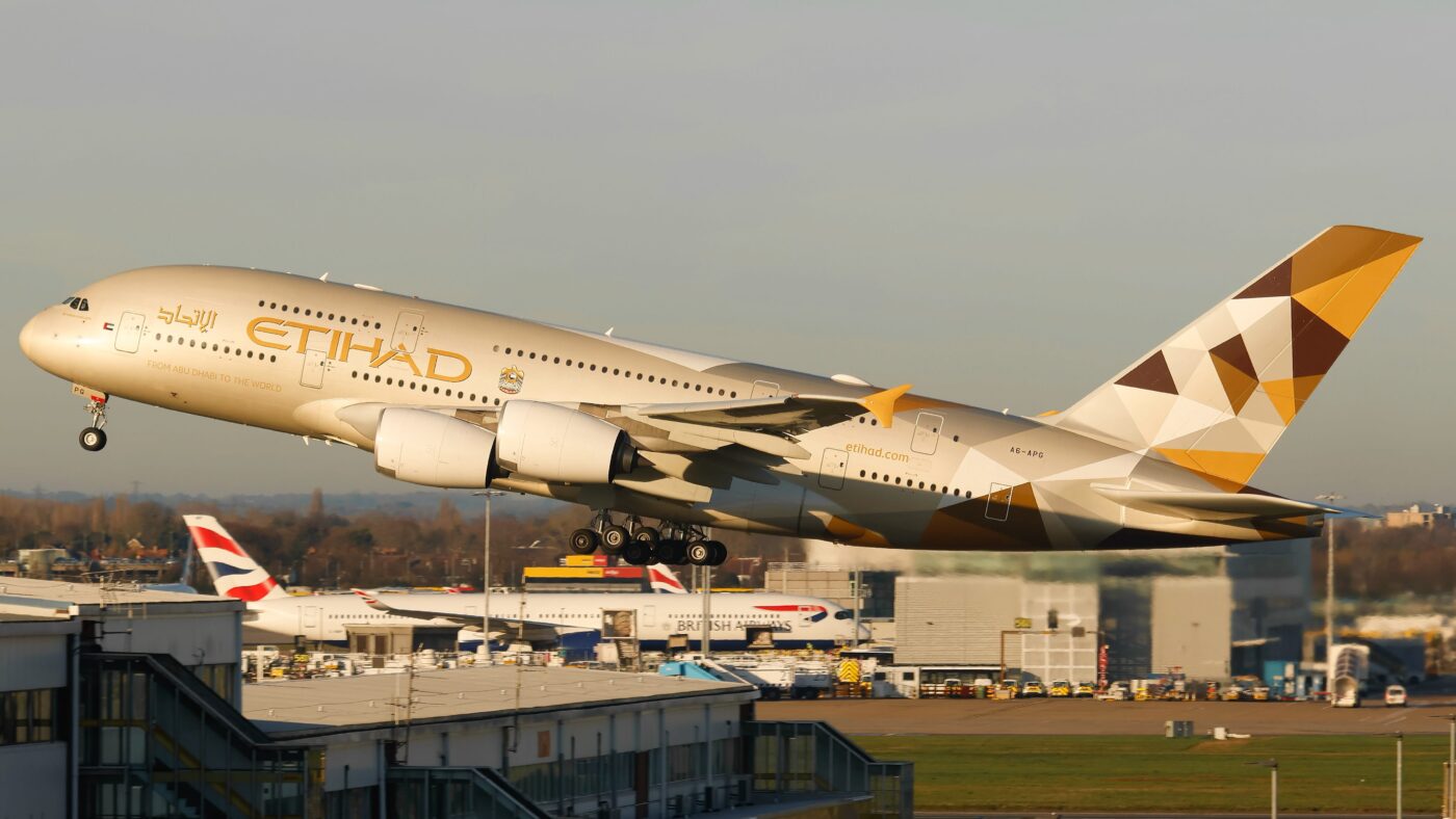 Etihad’s Final Stored A380 Leaves Tarbes for Abu Dhabi Etihad Airways’ last Airbus A380 remaining in pandemic-era storage has left southern France for Abu Dhabi, bringing the airline closer to restoring all nine of its surviving superjumbos to passenger service. The aircraft, registered A6-APB, departed Tarbes-Lourdes-Pyrénées Airport on September 17, 2026. Its departure closes a lengthy storage chapter, but further maintenance is required before it carries passengers again. ## From Tarbes storage to Abu Dhabi A6-APB was delivered to Etihad in 2015 and withdrawn from service in 2020, when the airline grounded its entire A380 fleet as international travel collapsed. It arrived in Tarbes in December that year. The aircraft left shortly after 09:30 local time on September 17, bound for Abu Dhabi’s Zayed International Airport. AeroTime reported that TARMAC Aerosave had spent eight months preparing it for the flight. Long-term aircraft storage involves ongoing preservation work. TARMAC Aerosave says it protects stored aircraft and engines in accordance with manufacturers’ guidelines. Preparing an aircraft to fly out of storage, however, does not mean it is ready to resume scheduled passenger operations. A6-APB is due to undergo further heavy maintenance in Abu Dhabi. Previously reported plans placed its commercial return around January 2027; that remains a planned timeframe rather than a newly confirmed first passenger flight. ## Etihad moves towards nine operational A380s Etihad originally received ten A380s between 2014 and 2017. After grounding them in 2020, the airline brought the type back into passenger service in 2023, initially on its Abu Dhabi–London Heathrow route. Nine aircraft remain following the dismantling of A6-APA in 2025. A6-APB’s eventual return would complete the restoration of that surviving fleet. Its sister aircraft, A6-APC, followed a similar sequence earlier this year: a ferry flight back to Abu Dhabi in January, followed by a return to passenger service in June. ## Bangkok joins the A380 network in October The recovery comes as Etihad prepares to introduce the A380 on its Bangkok route from October 25, 2026. The airline has announced a daily evening departure from Abu Dhabi using the double-decker during the winter travel season. Etihad’s A380 offers nine First Apartments, 70 Business seats and 405 Economy seats, alongside The Residence, its private three-room suite for up to two guests. Bangkok’s launch precedes A6-APB’s anticipated return. No specific passenger route has been announced for the aircraft, whose next step is completing its maintenance programme in Abu Dhabi.