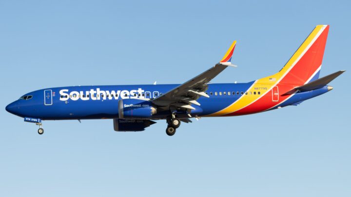 Southwest Airlines Boeing 737 MAX 8 N8779Q approaching landing against a clear blue sky.